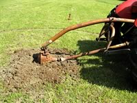 Almost buried the post hole auger